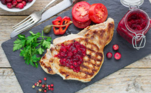 Grilled meat with cranberry sauce.